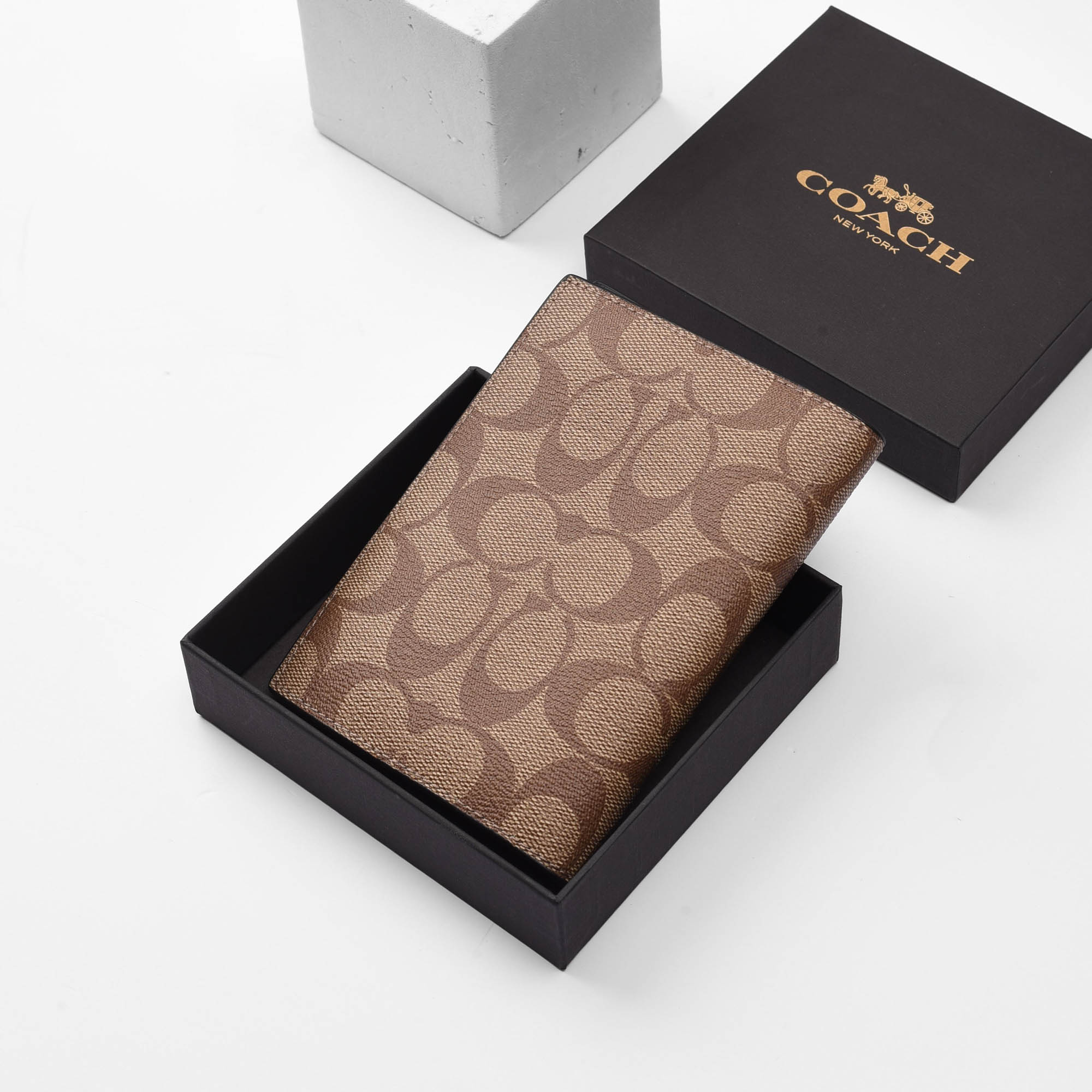 COACH SIGNATURE CANVAS PASSPORT WALLET - BROWN